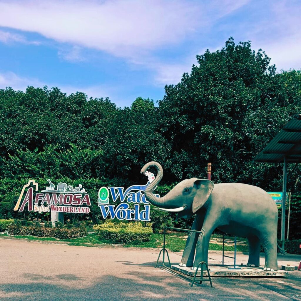 Entrance to A'Famosa Safari Wonderland in Melaka, Malaysia, featuring the iconic elephant statue. A popular family attraction offering elephant swimming shows, crocodiles swimming overhead, monkey photo experiences, safari adventure, wildlife encounters and Water World.